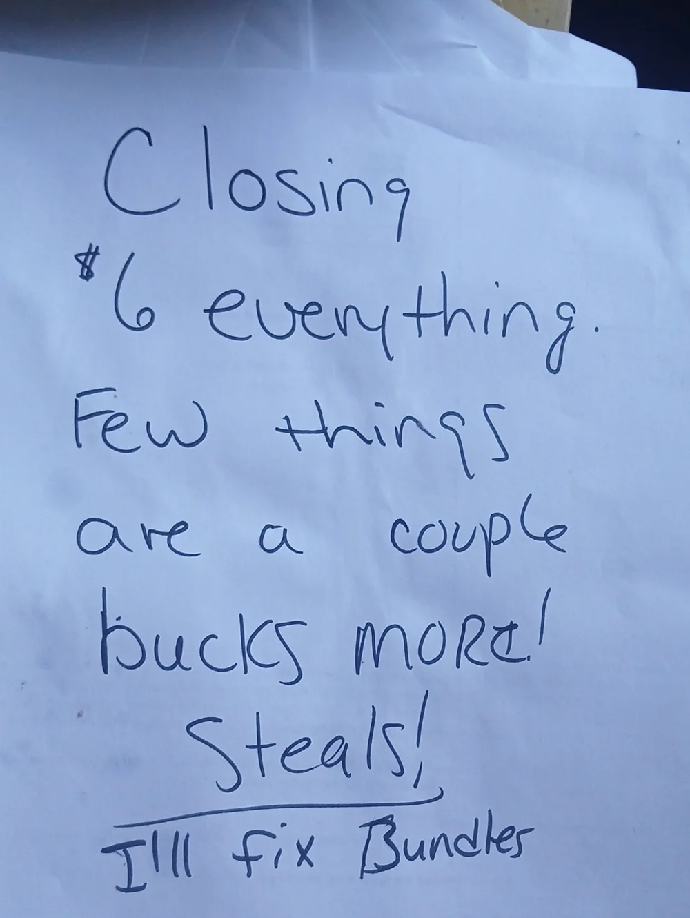 Handwritten Closing Sale Sign - Blue Ink on White Paper